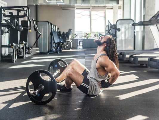 athletic man suffering from lower back pain