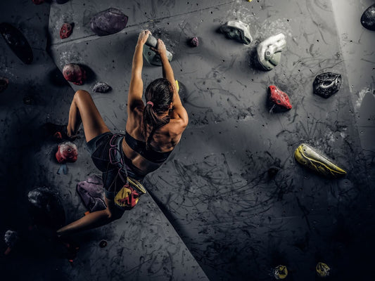 woman rock climbing depicting the safety of cbd