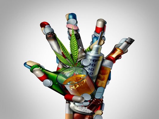 hand made up of addictive drugs