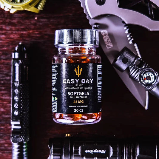 A close-up image of 25mg CBD Softgels in a well-lit setting, showcasing their sleek and easy-to-swallow design.